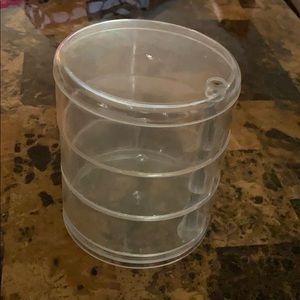 Clear tiered storage container- rotatable levels